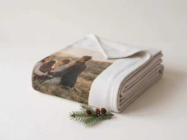 Fleece Christmas blanket folded in a stack showing its square corners