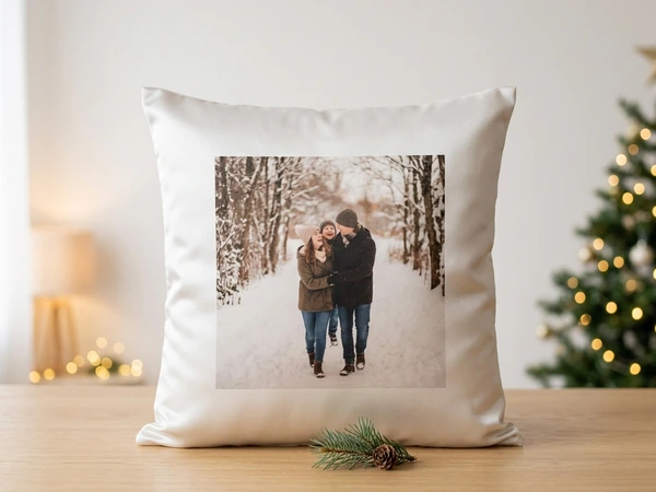 Satin Christmas pillow with a smooth sheen standing against a pale background