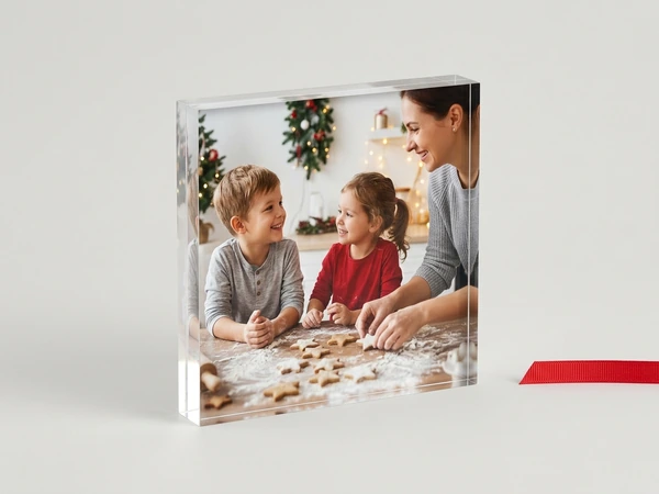 Acrylic print of a woman, a boy and a girl cutting star cookies at a floured table