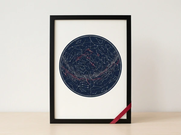 Black framed star map with a round constellation chart on navy