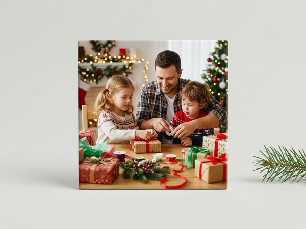 MIXPIX tile of a man and two children wrapping presents at a table by a Christmas tree