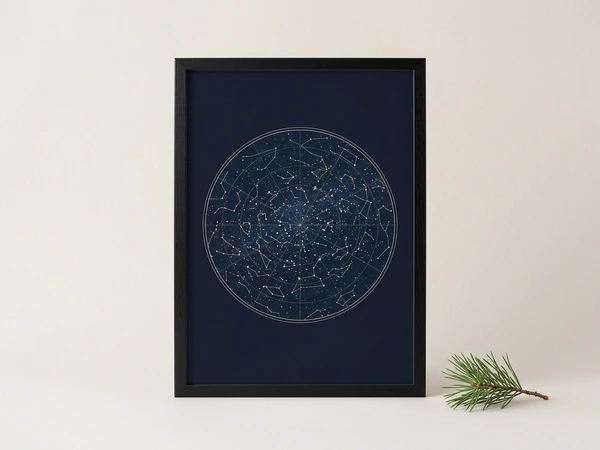 Black framed star map with a round constellation chart on navy