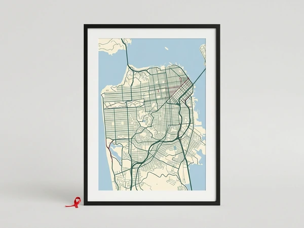 Black framed city map poster with a street grid in green on cream and blue water