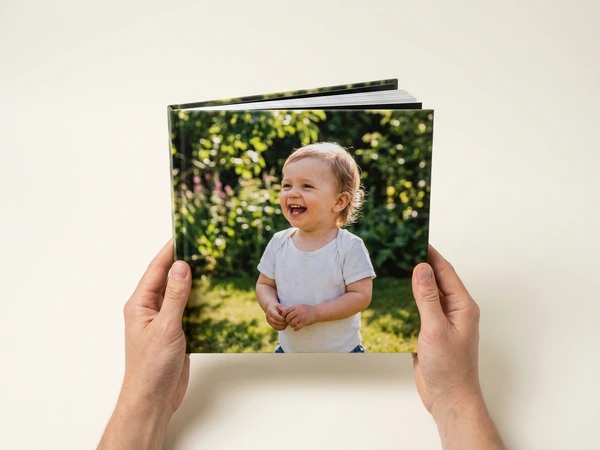Photo book with a smiling toddler on the cover