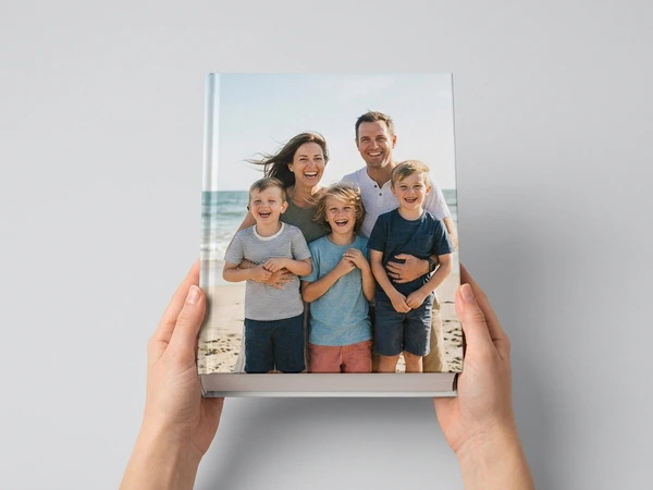 Hardcover photo book with a family beach photo on the cover
