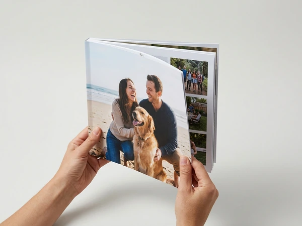 8x8 softcover photo book with a couple and their dog on the cover