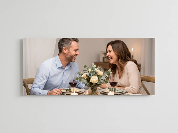 Panoramic acrylic print of a couple laughing over dinner with red wine and candles