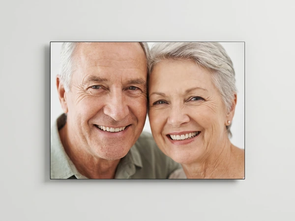 Metal print of a close-up of a smiling older couple with silver hair