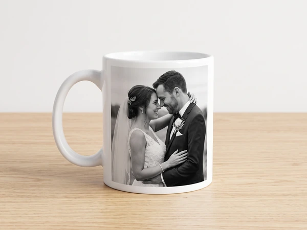 White mug printed with a black and white photo of a bride and groom embracing