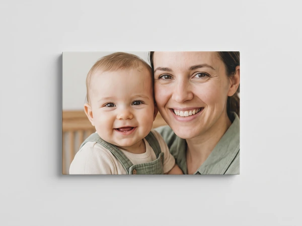 Canvas print of a smiling baby cheek to cheek with its mother