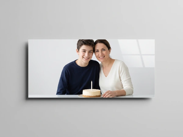 Panoramic acrylic print of a teenage boy and his mother with a small birthday cake
