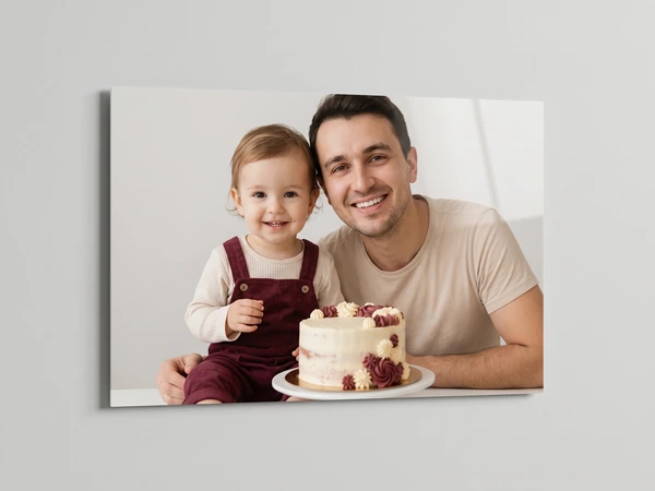 Acrylic print at an angle of a father and toddler with a berry-topped cake