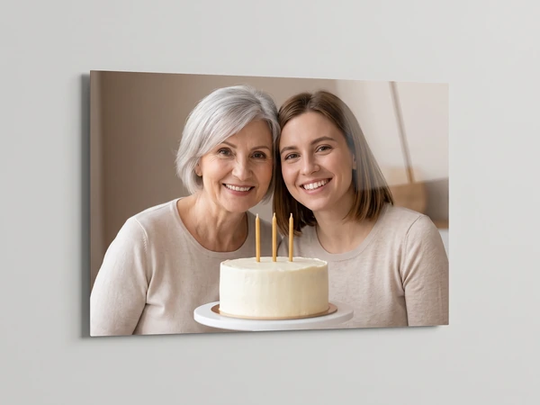 Acrylic print of a grandmother and her daughter behind a cake with three candles
