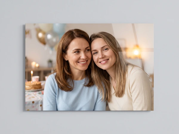 Acrylic print of two women smiling cheek to cheek at a birthday party