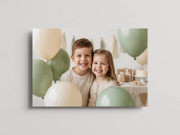 Metal print of a brother and sister surrounded by sage and cream balloons