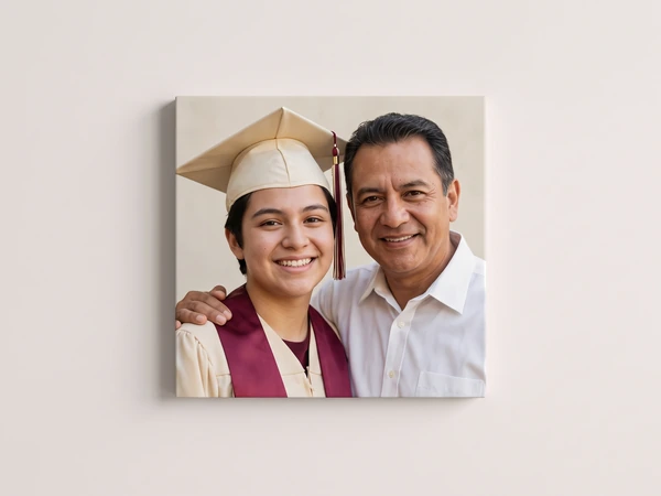 Canvas print of a graduate in a cream cap and maroon stole with her father