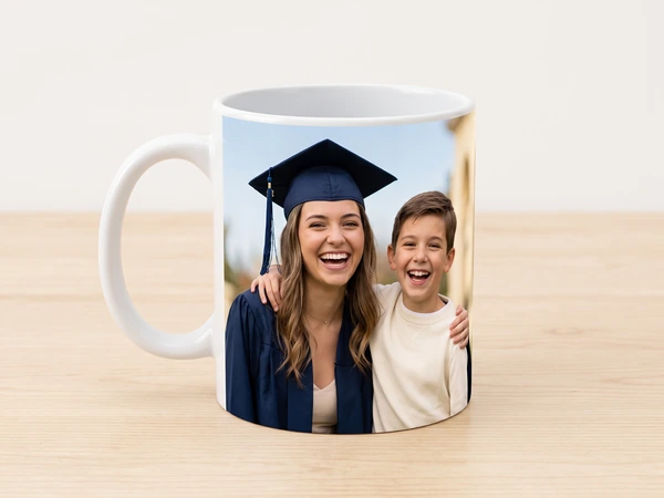 Photo mug printed with a laughing graduate and a young boy