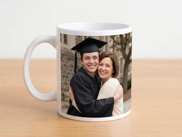 Classic photo mug printed with a graduate hugging his mother outdoors