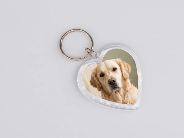 Heart keychain with a close photo of a golden retriever's face