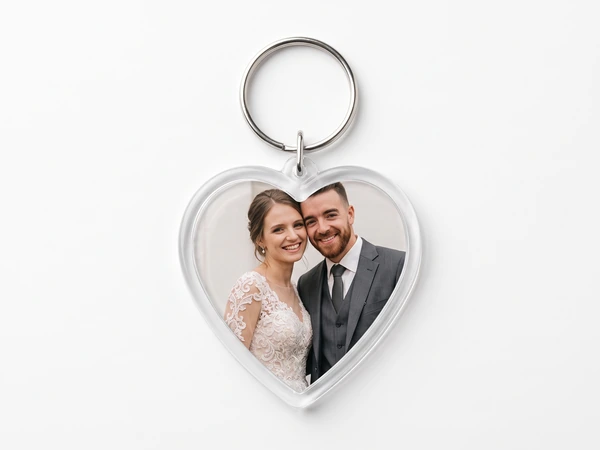 Heart keychain with a photo of a bride and a groom in a gray vest