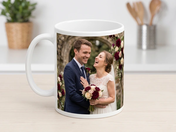 Photo mug printed with a laughing bride and groom holding burgundy roses