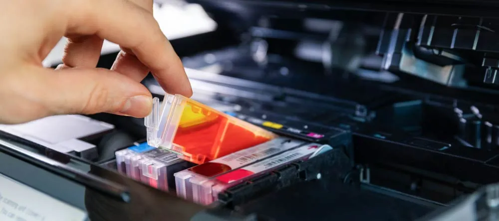 What is a Canvas Print? Ink cartridges being put in printer.