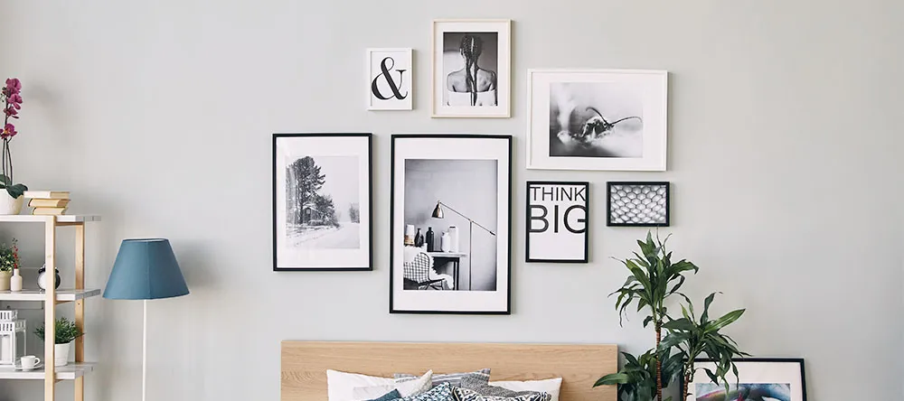 How to Make a Gallery Wall. Selection of photo prints on wall.
