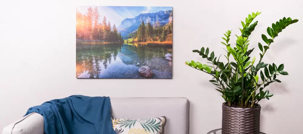 How to Hang Canvas on Wall. Large-format canvas print displayed on a living room wall.