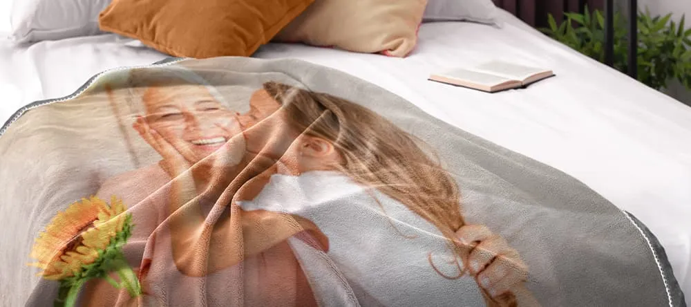 throw blanket printed with a photo laid on a bed