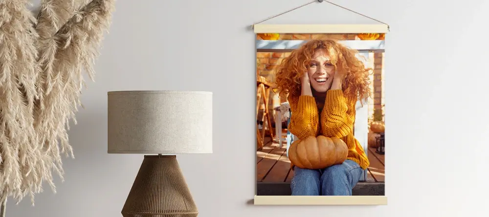 How to decorate for fall: a photo of a woman with a pumpkin on her knees