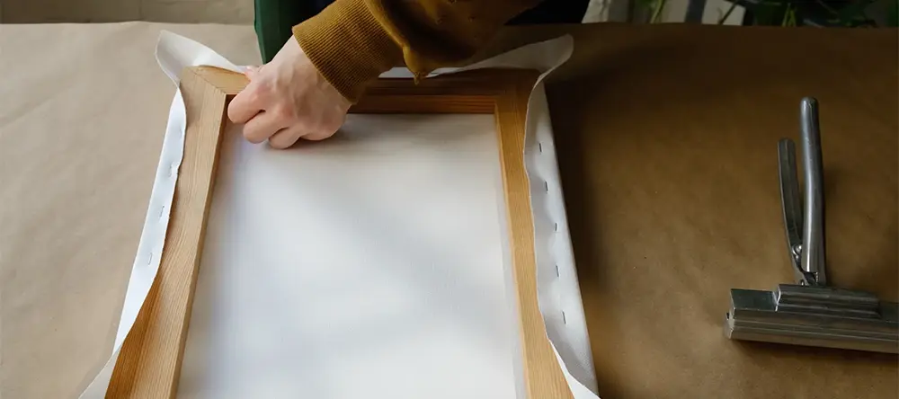 Preparing unmounted canvas using gallery wrap and panel techniques