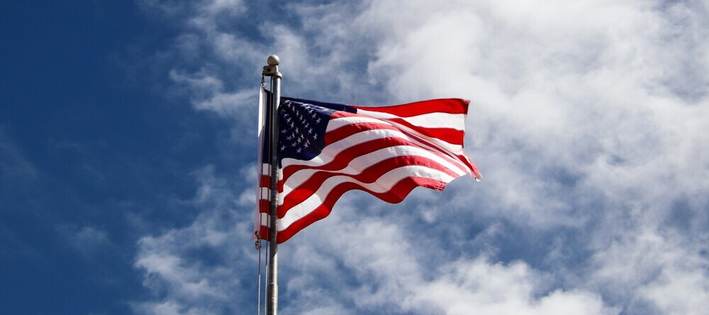 Where to Buy Canvas Prints in the US. American flag against blue sky.