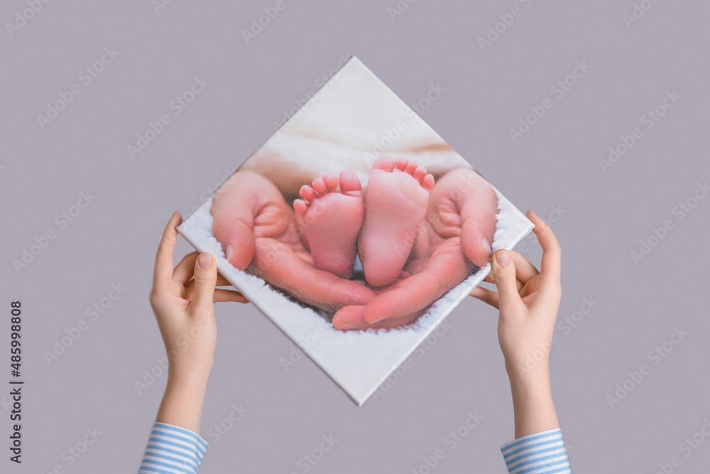 New mother holding baby printed as a canvas keepsake for first Mother’s Day