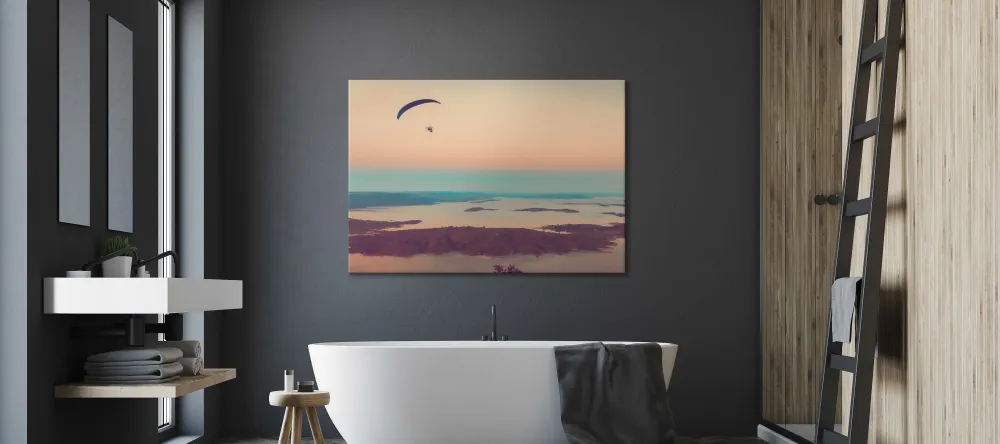 Should you display canvas in bathroom? Canvas print with sunset displayed in modern bathroom.