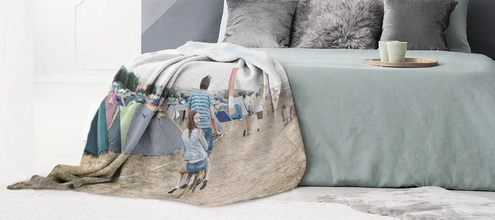 Where to create a blanket with your own picture on it. Photo blanket with couple in festival.