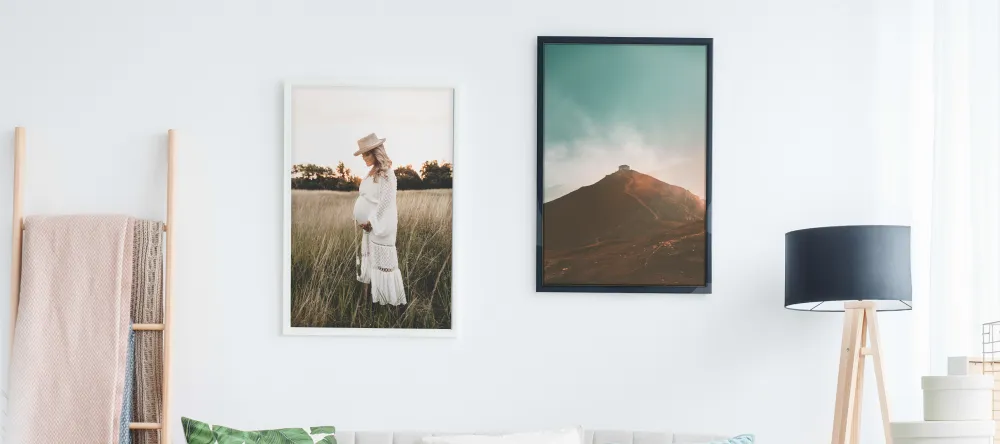 How much does it cost to get canvas framed. Two framed photo prints with black and white frame on the wall. 