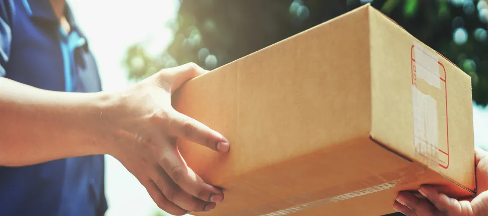 Getting Your Canvas Prints Delivered on Time. Delivery service giving parcel to customer. 