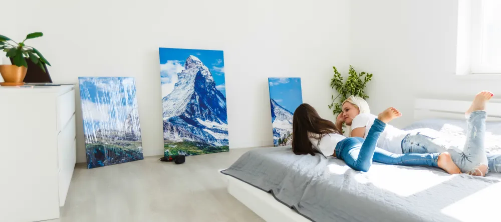 Why are Canvas Prints so Expensive? Mother and daughter looking at photo canvas prints. 