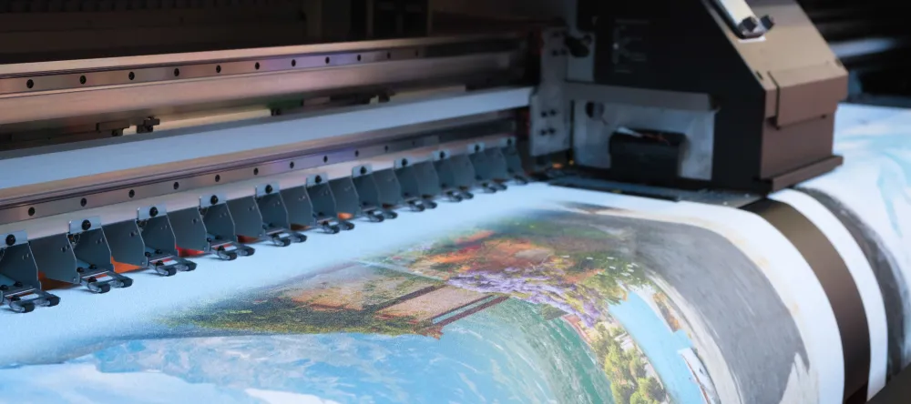 What is canvas made of. Image of industrial printer printing on canvas.