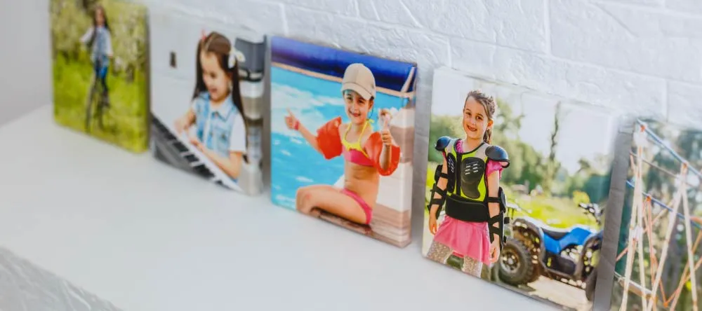 Custom-Made Canvases: 10 Myths Debunked. Multiple small-size canvas prints on mantel.