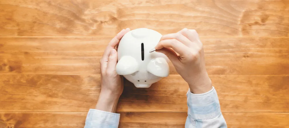 Why Should I Buy Canvas Prints. Man with a Piggy Bank.