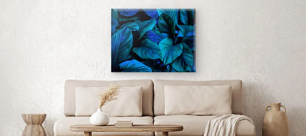 Trendy Canvas Wall Art: a bright blue canvas print on the grey wall