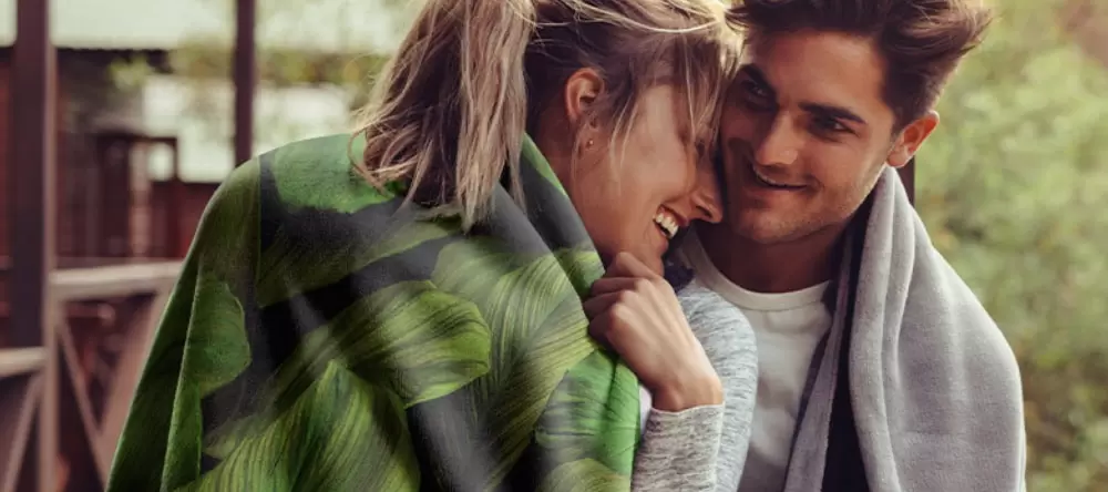 Who Makes the Best Photo Blankets? Young couple sharing a tender moment.