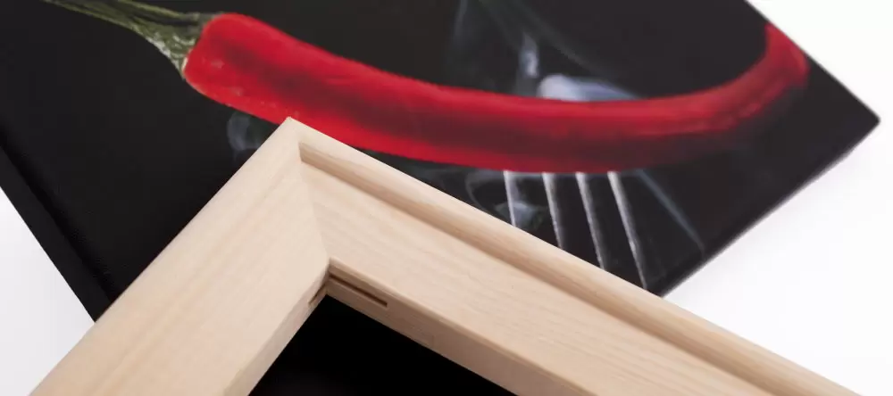 What is the difference between print and poster. Canvas frame and pepper photo print close-up.