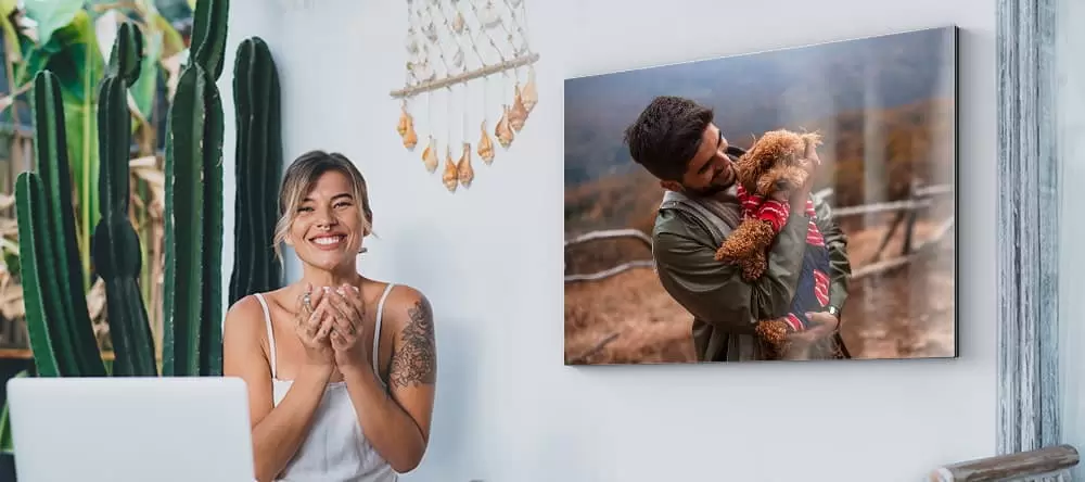Canvas art for outdoors: a person standing on the terrace before a metal print on the wall