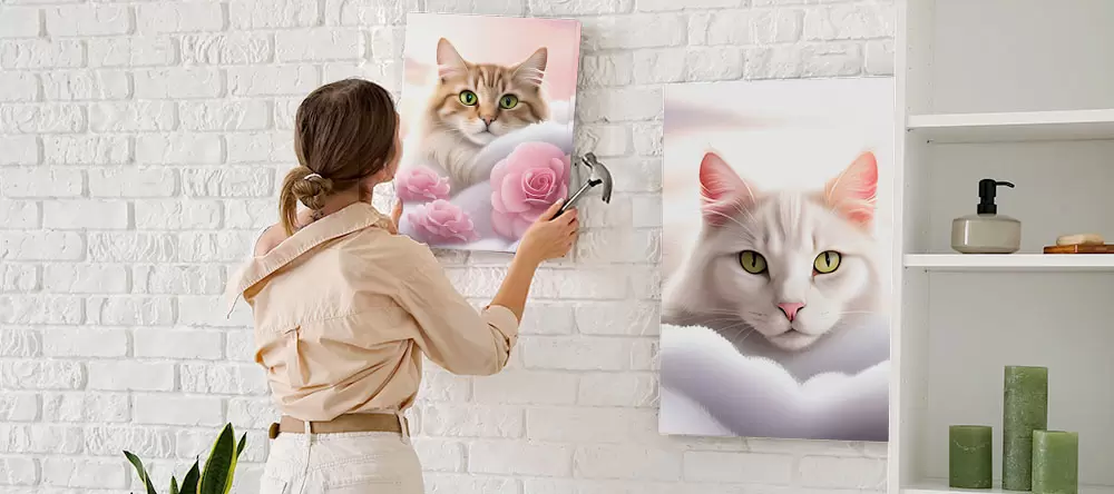 Cat canvas art: woman hanging cat canvas prints on the wall