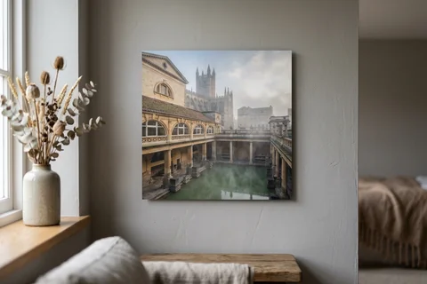aluminium photo print bath – a matte aluminium panel print of the Roman Baths in morning mist mounted flush on a grey wall