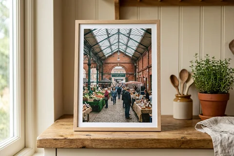 framed photo board belfast – a slim-framed photo board of St George's Market standing on a kitchen shelf
