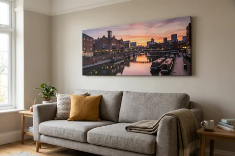 panoramic canvas print birmingham – a wide panoramic canvas of the canal at Brindleyplace at sunset hung above a long sofa