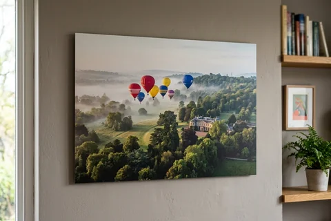 aluminium photo print bristol – a matte aluminium panel print of hot-air balloons over Ashton Court in morning mist mounted flush on a grey wall